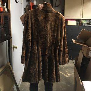 Below knee mink pieces. 2 buttons flare pockets