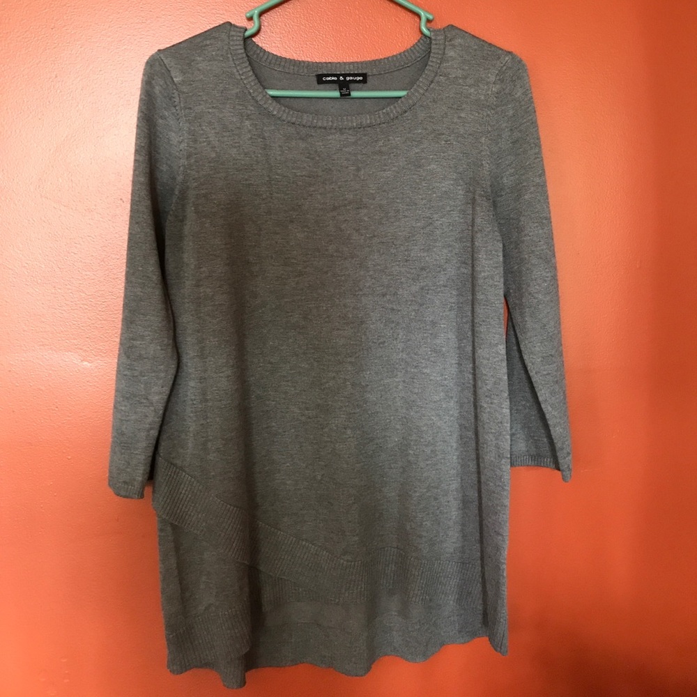 Asymmetrical detailed gray sweater.