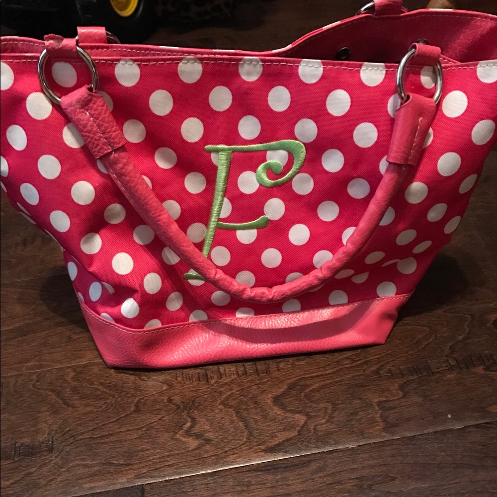 Pink and white polka dot bag with initial F