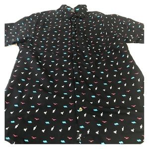 Red white and blue shirt with dinosaur pattern.