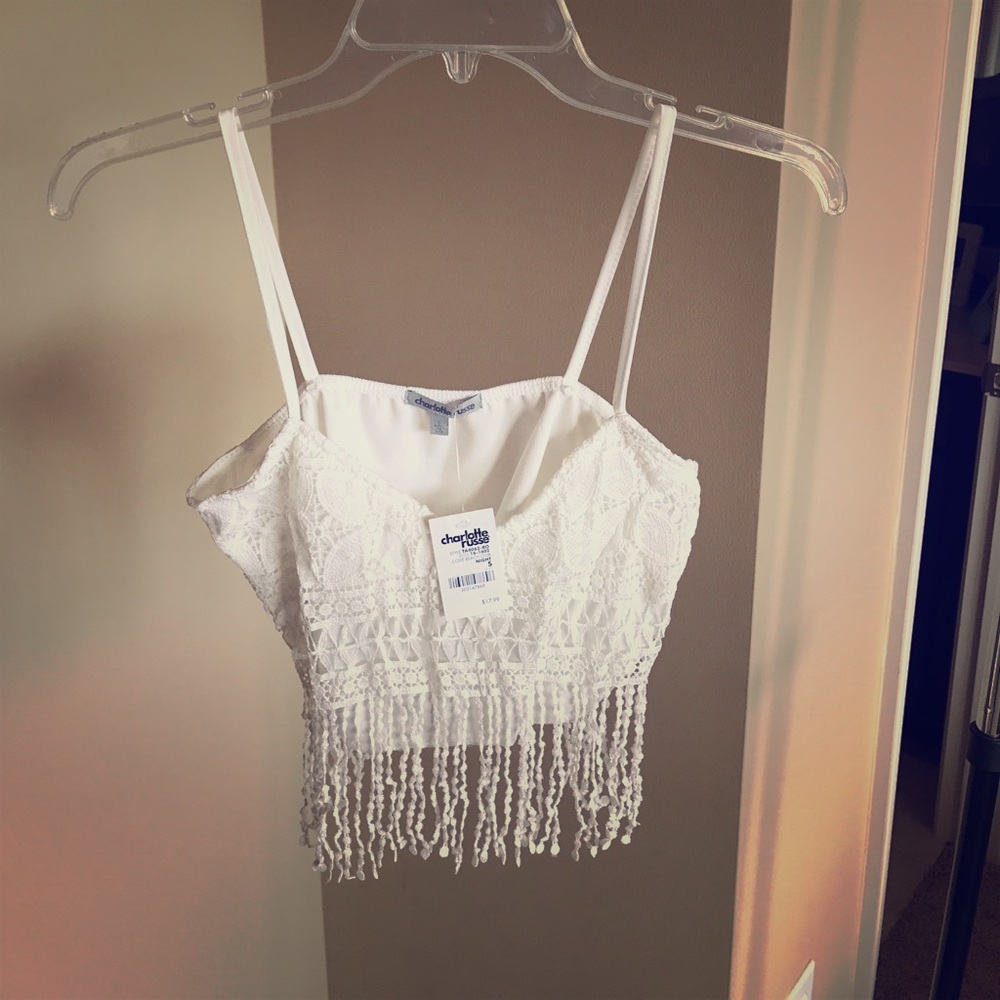 White crop top with lace detail.