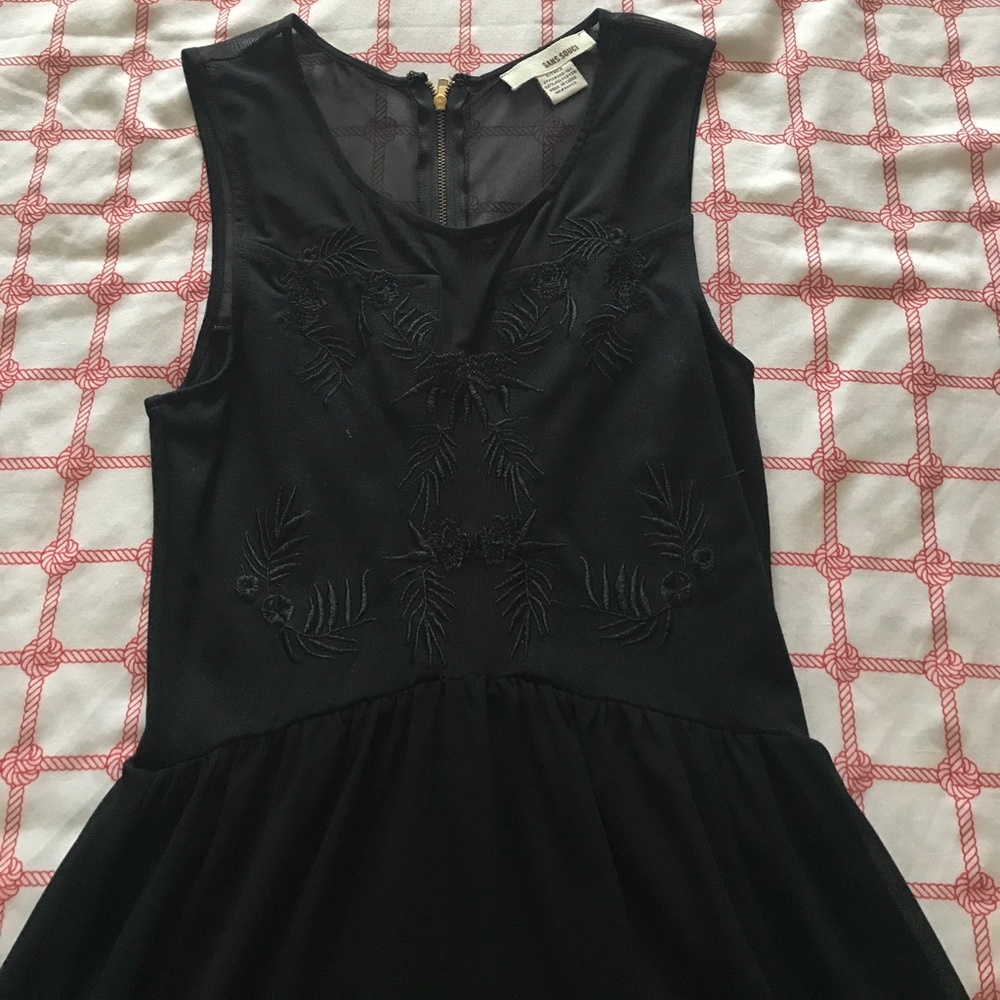 A black dress with floral detailing