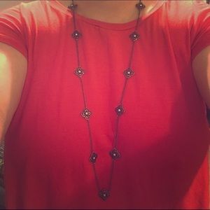 Quatrefoil long necklace.