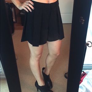 Black pleated Jennifer Lopez high waisted shorts