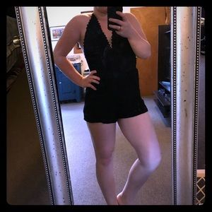 Black, backless romper.