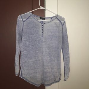 A size small, greyish-blue top.