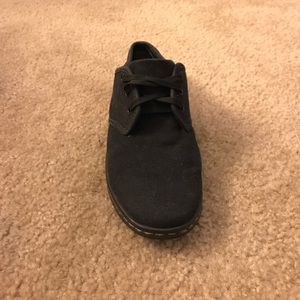 Black Dr. Marten shoes.