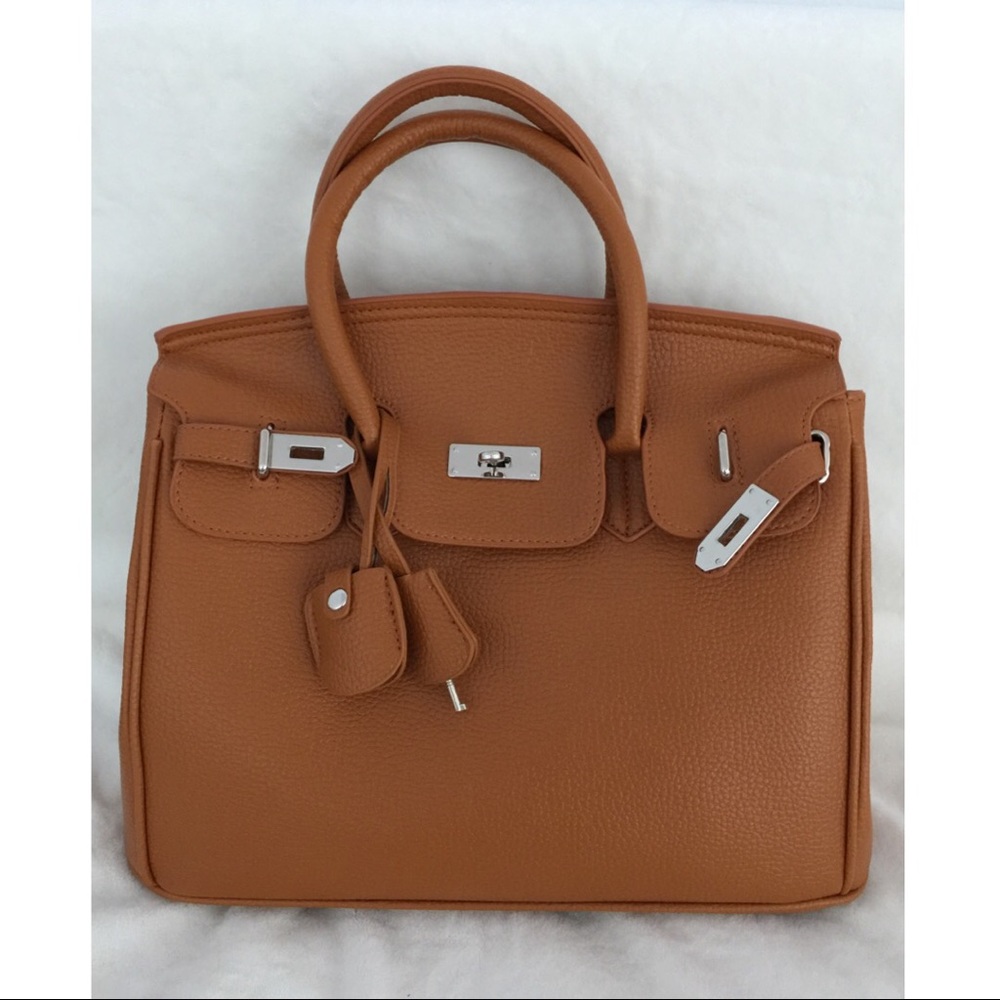 👜