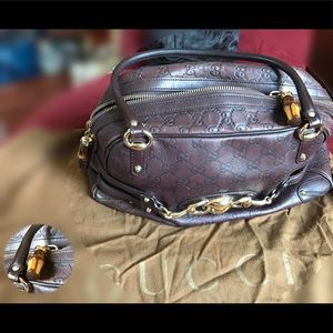 Guccis leather handbag (guccisma print)