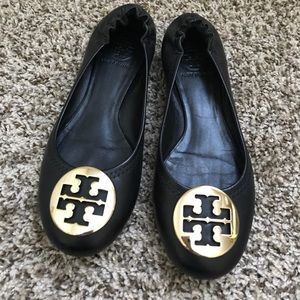 Black Tory Burch Reva flats with gold emblem