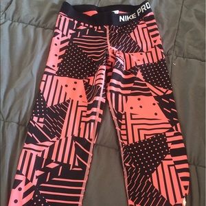 Peach patterned Nike pros