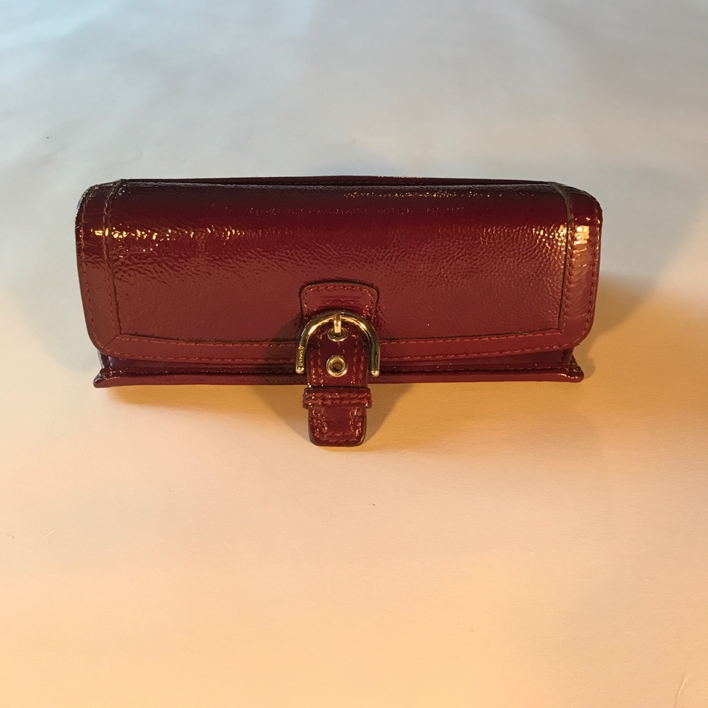 Coach Soho Buckle Tri-Fold wallet.