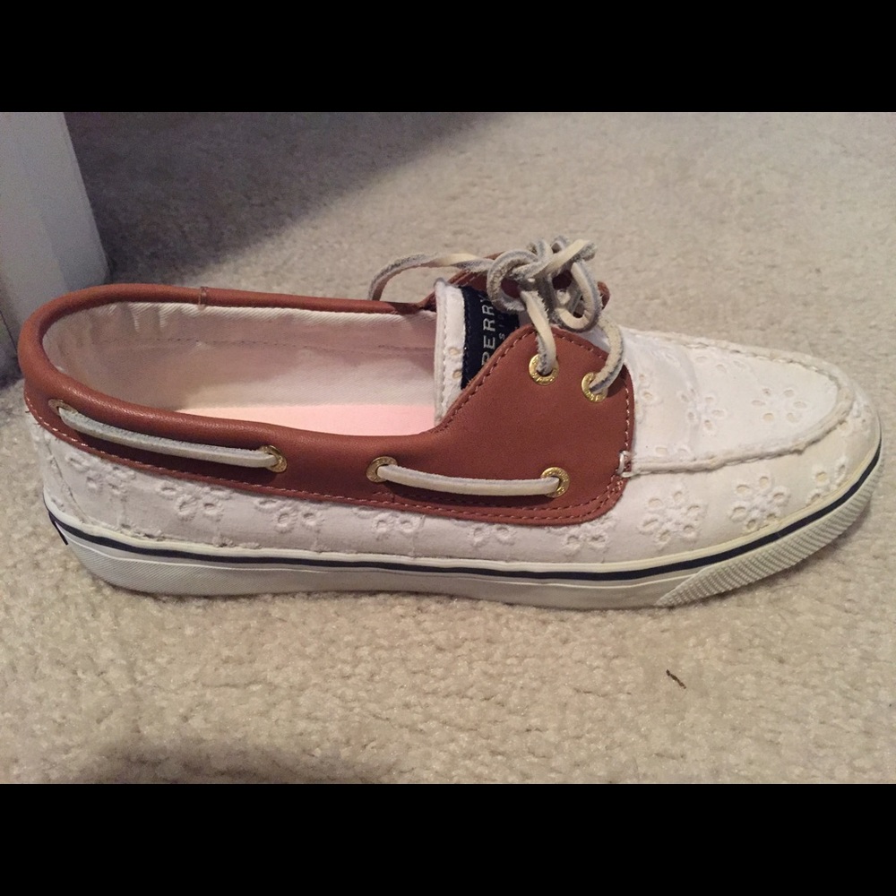 White eyelet Sperrys with leather detail