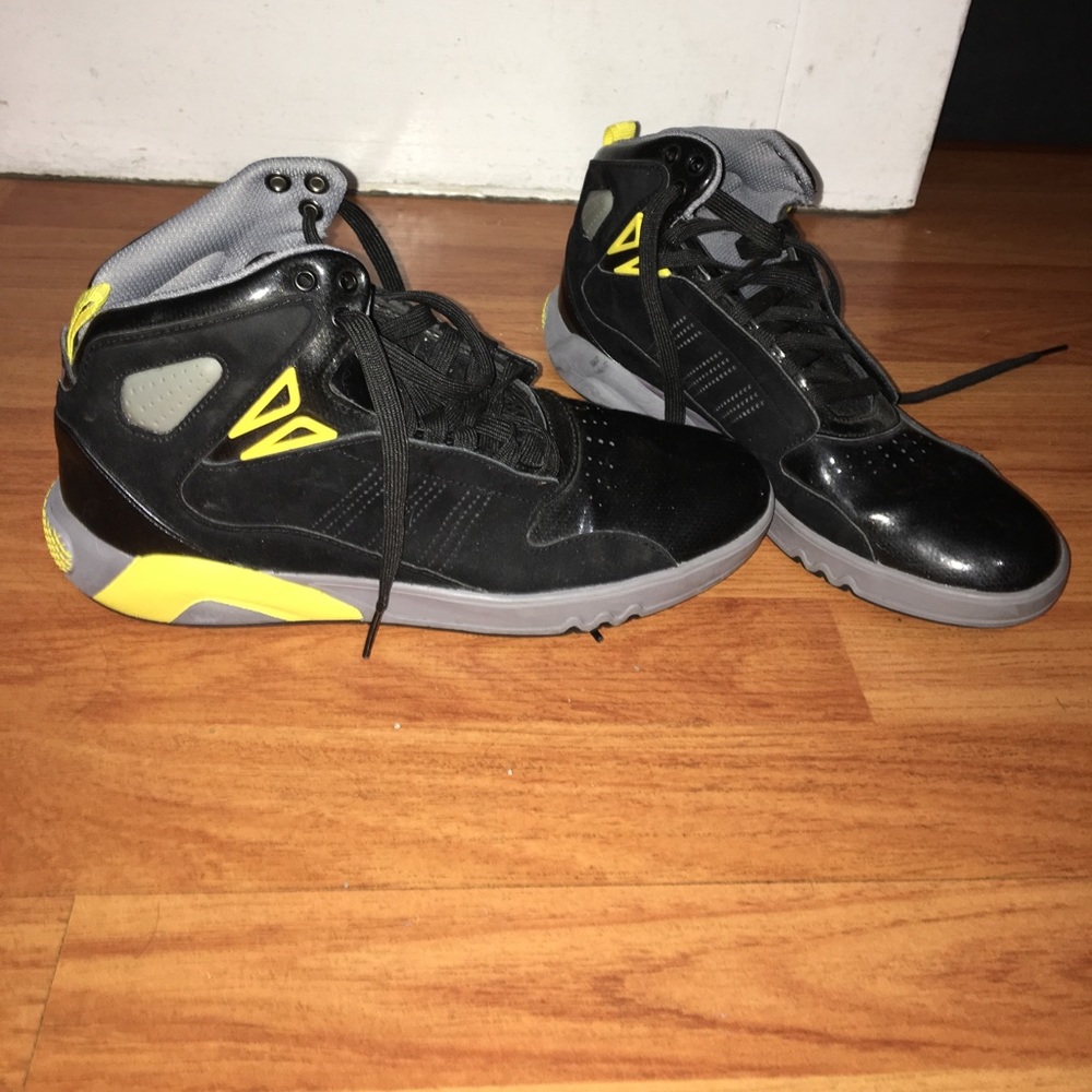 Black and yellow adidas basketball sneakers