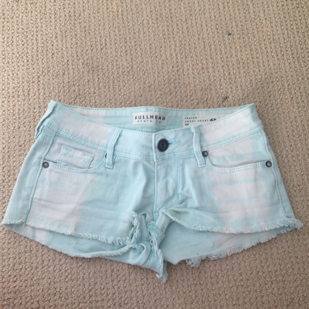 blue frayed shorts