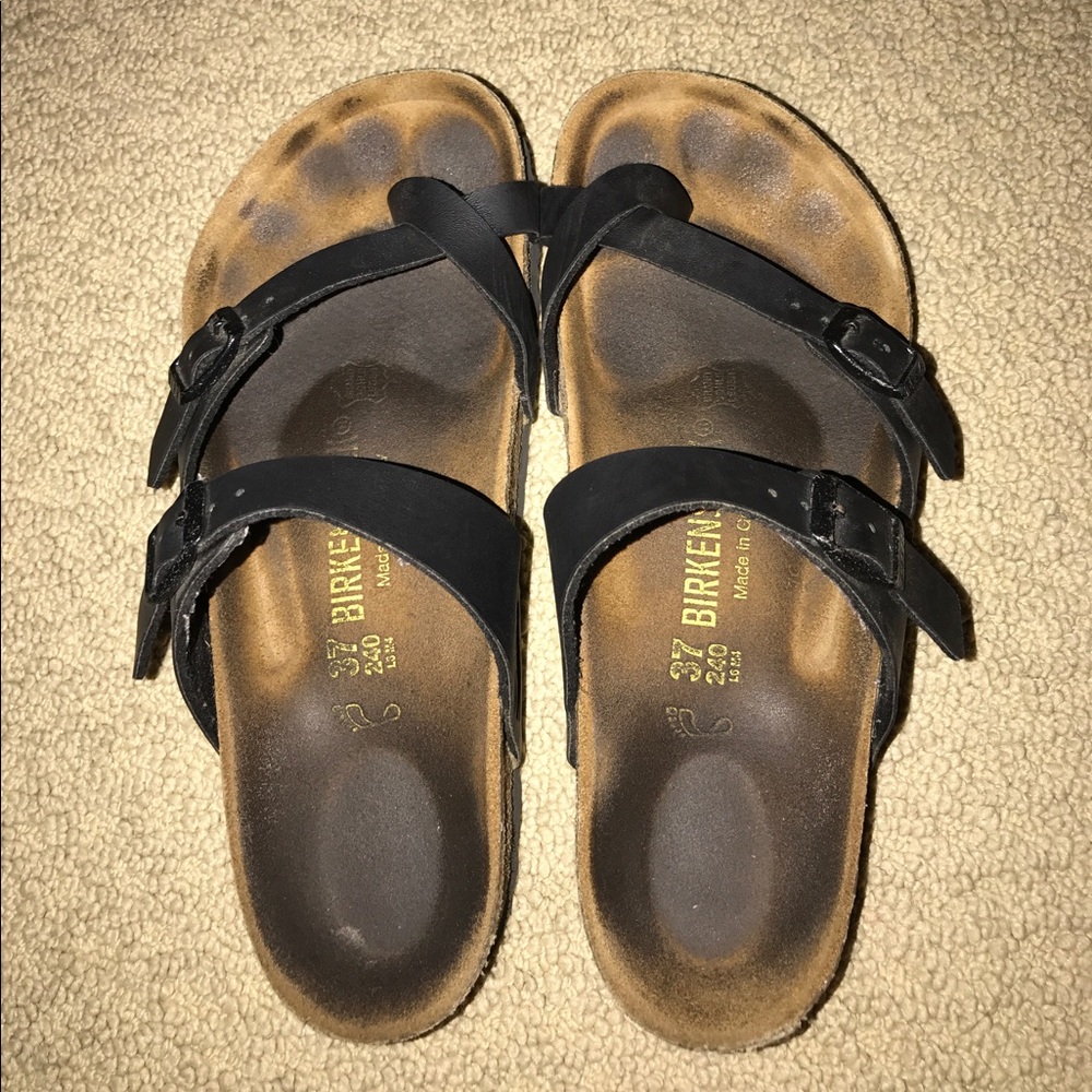 worn black birkenstock sandals