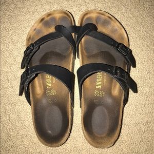 worn black birkenstock sandals