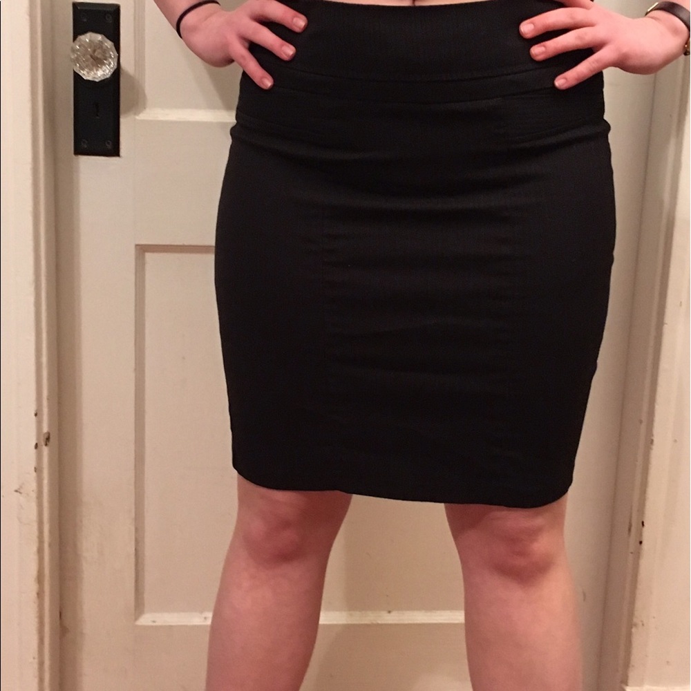 Black/dark gray pencil skirt with flounce in back.