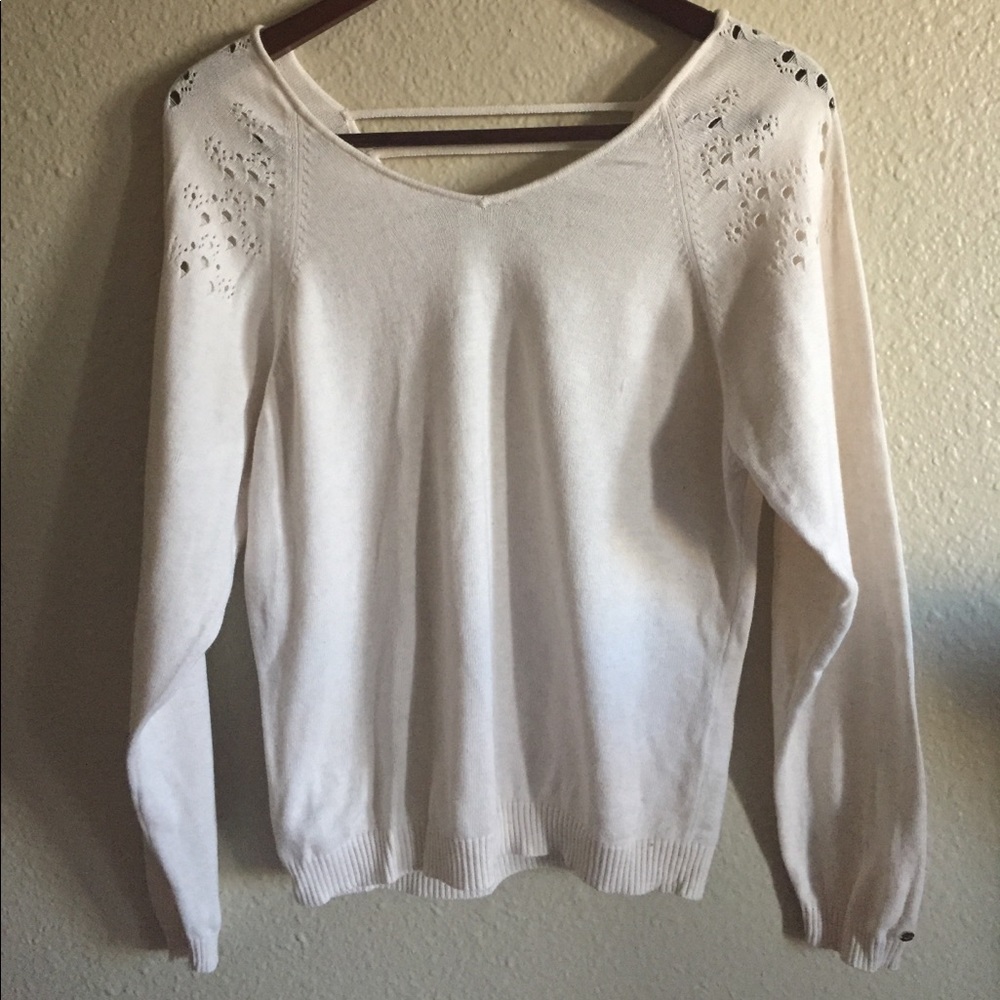 Cream sweater with small crochet design