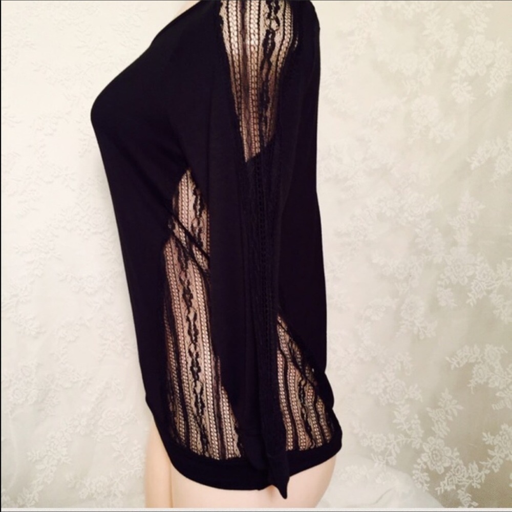 Black blouse with mesh material 3/4 sleeve.