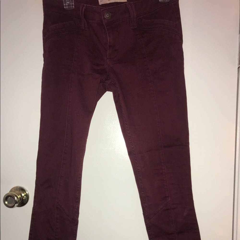 Burgundy mid rise Hollister super skinny jeans