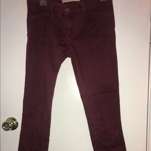 Burgundy mid rise Hollister super skinny jeans