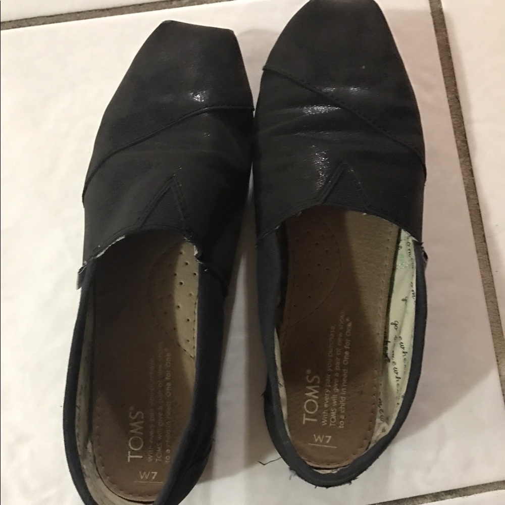 Toms black slip ons