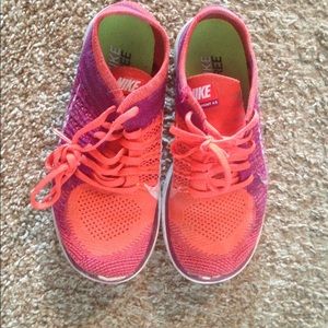 Red and purple flyknit Nike free