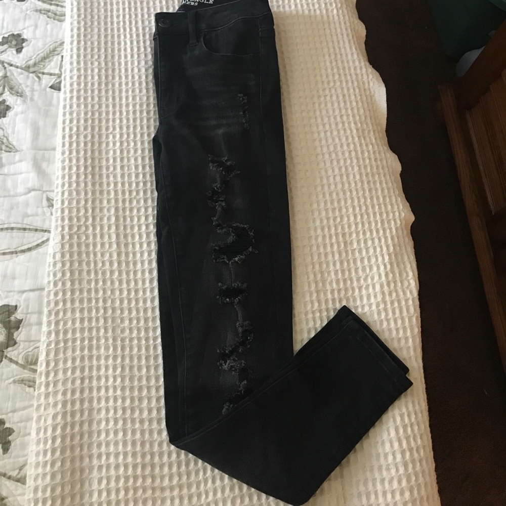 High-rise black distressed jeans