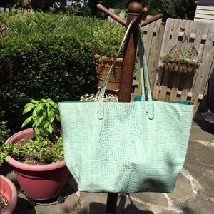 Light green snake skin handbag.