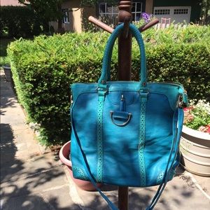 Big Buddha teal handbag.