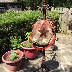 Green and brown star cross body bag.