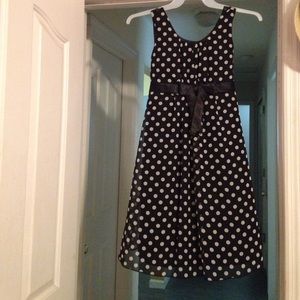 Black polka dot dress with black bow