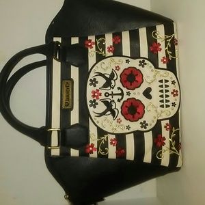 Big purse, sugar skull, black and white striped