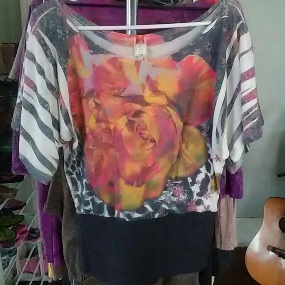 Cute large slightly faded top.