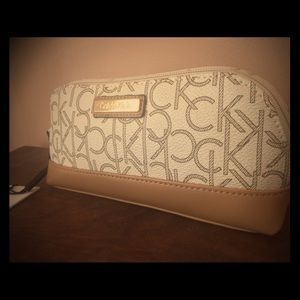 NWT Monogrammed Calvin Klein makeup bag brand new!