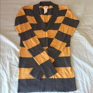 Dark yellow and grey sweater.