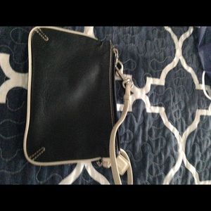 Navy blue Coach wristlet with white trim