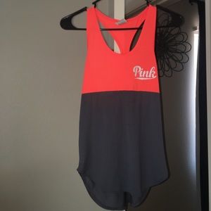 A pink top that is split between  two colors