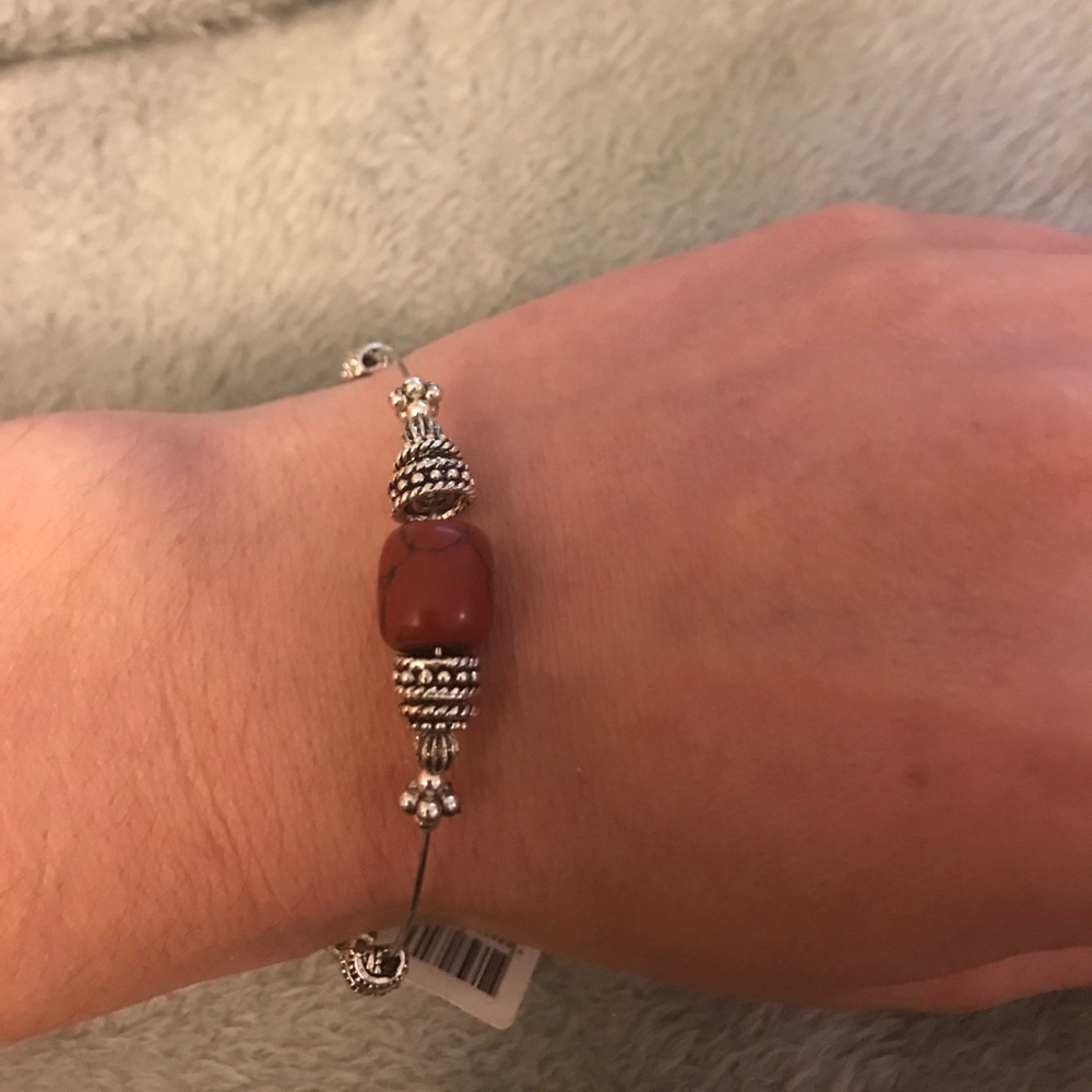 Silver wire bracelet with wine color bead