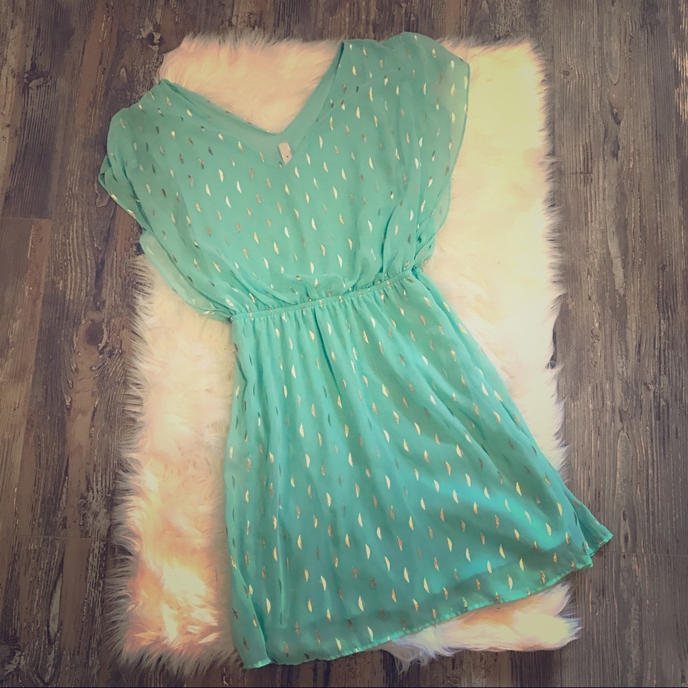 Turquoise and shiny gold dress