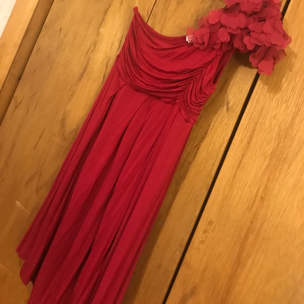Maroon flowered, one shoulder dress.