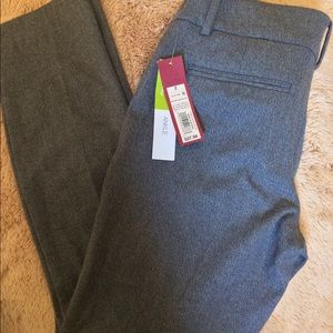 Mid rise, slim hip and thigh, ankle fit slacks
