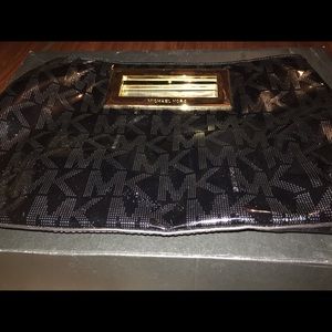 Black pants to leather Michael Kors clutch