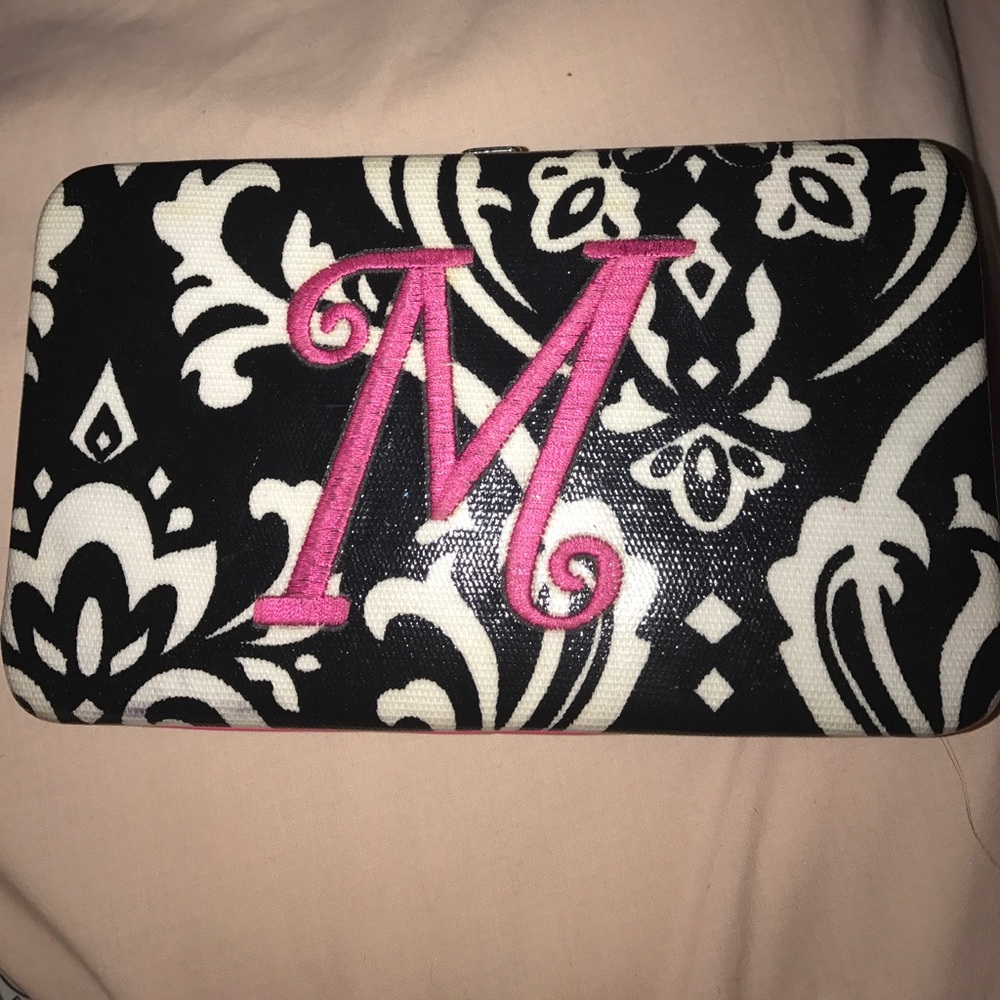A black and white designed monogram initial wallet