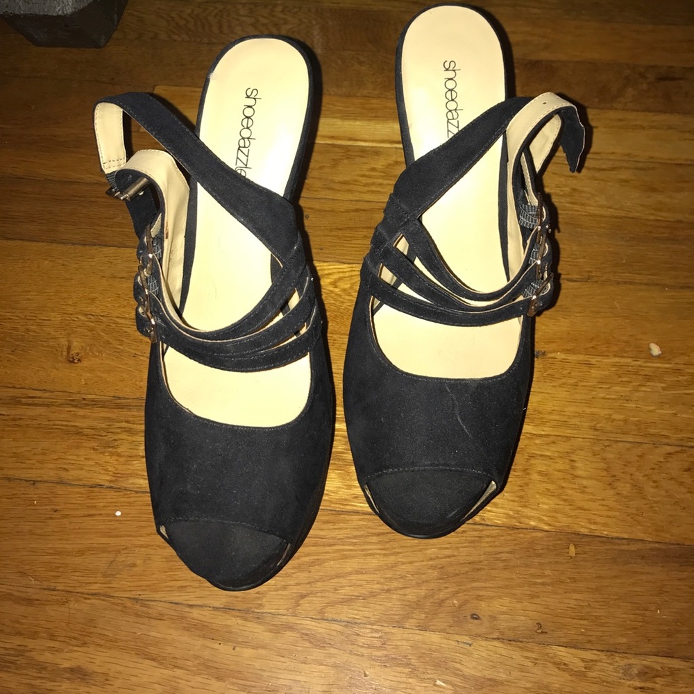 Black platform heels with gold accents