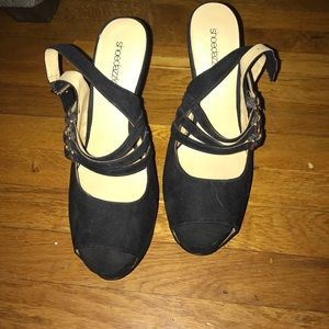 Black platform heels with gold accents