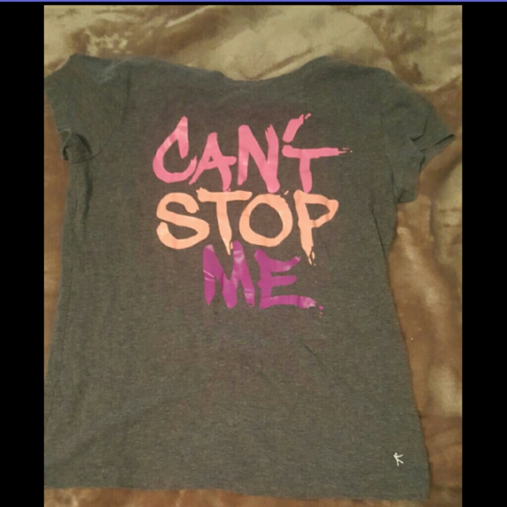 A pink peach colored purple and gray t-shirt