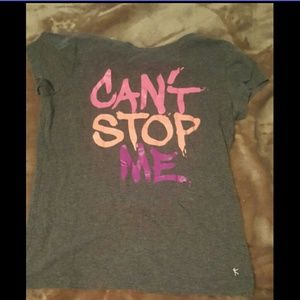 A pink peach colored purple and gray t-shirt