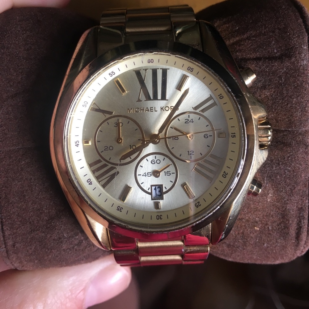 Women's gold Michael Kors watch